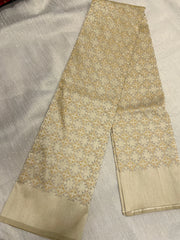 Hand embroidery close-up on beige kasuti bloom blouse